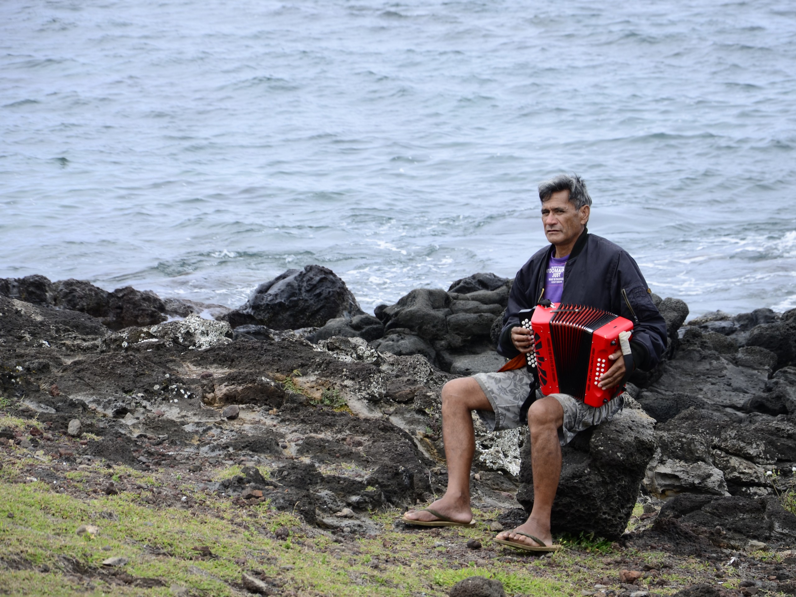 Lone traveller playing harmonica in Easter Island