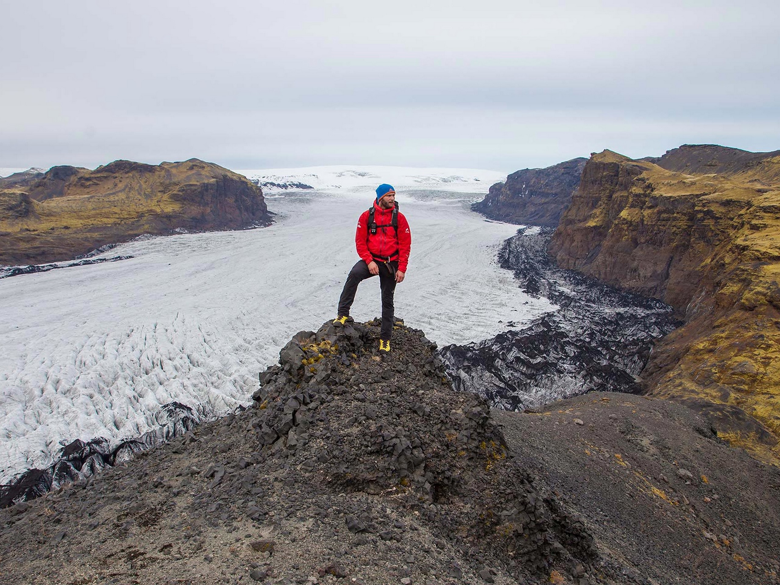Hiker posing in front of an icefield in Iceland