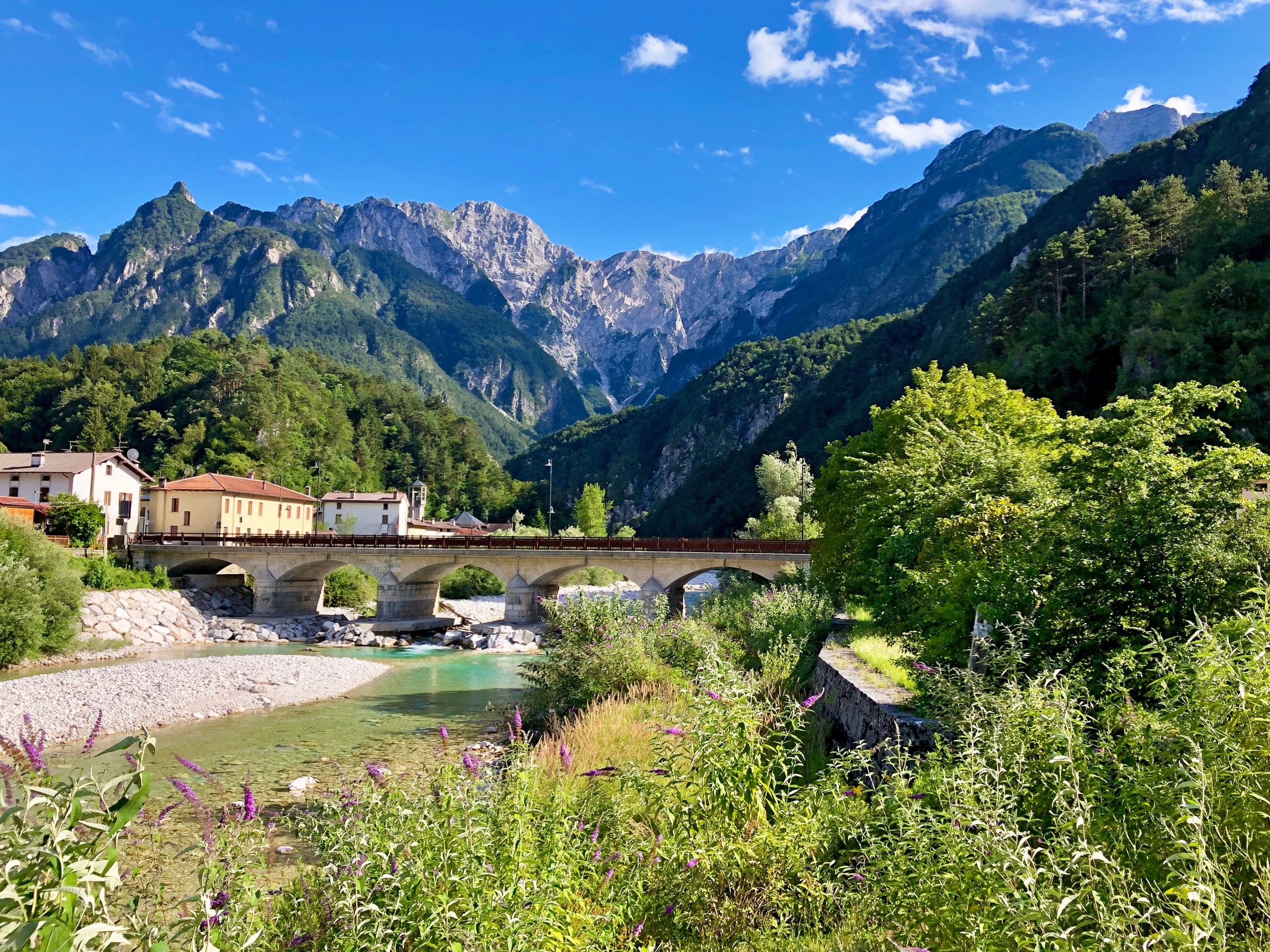 Small bridge over the river along the Alpe Adria trail