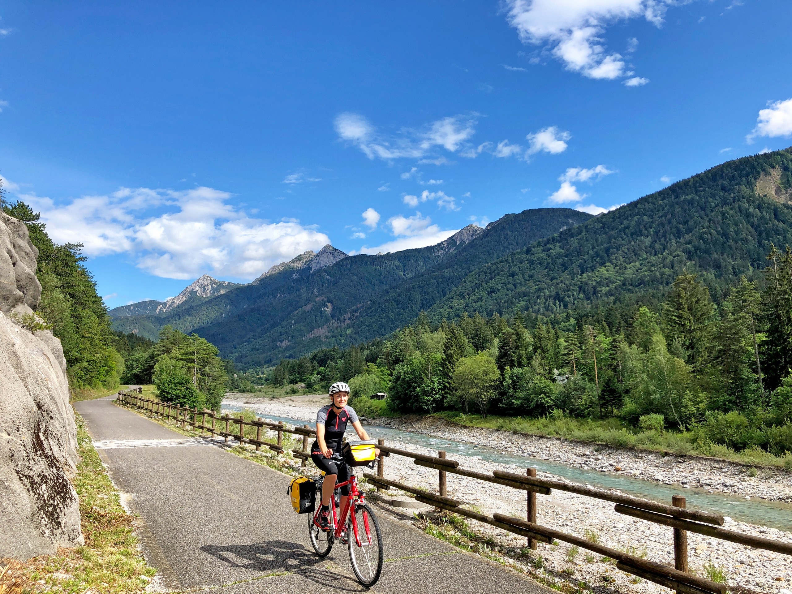 Cyclist biking along the river in Austria