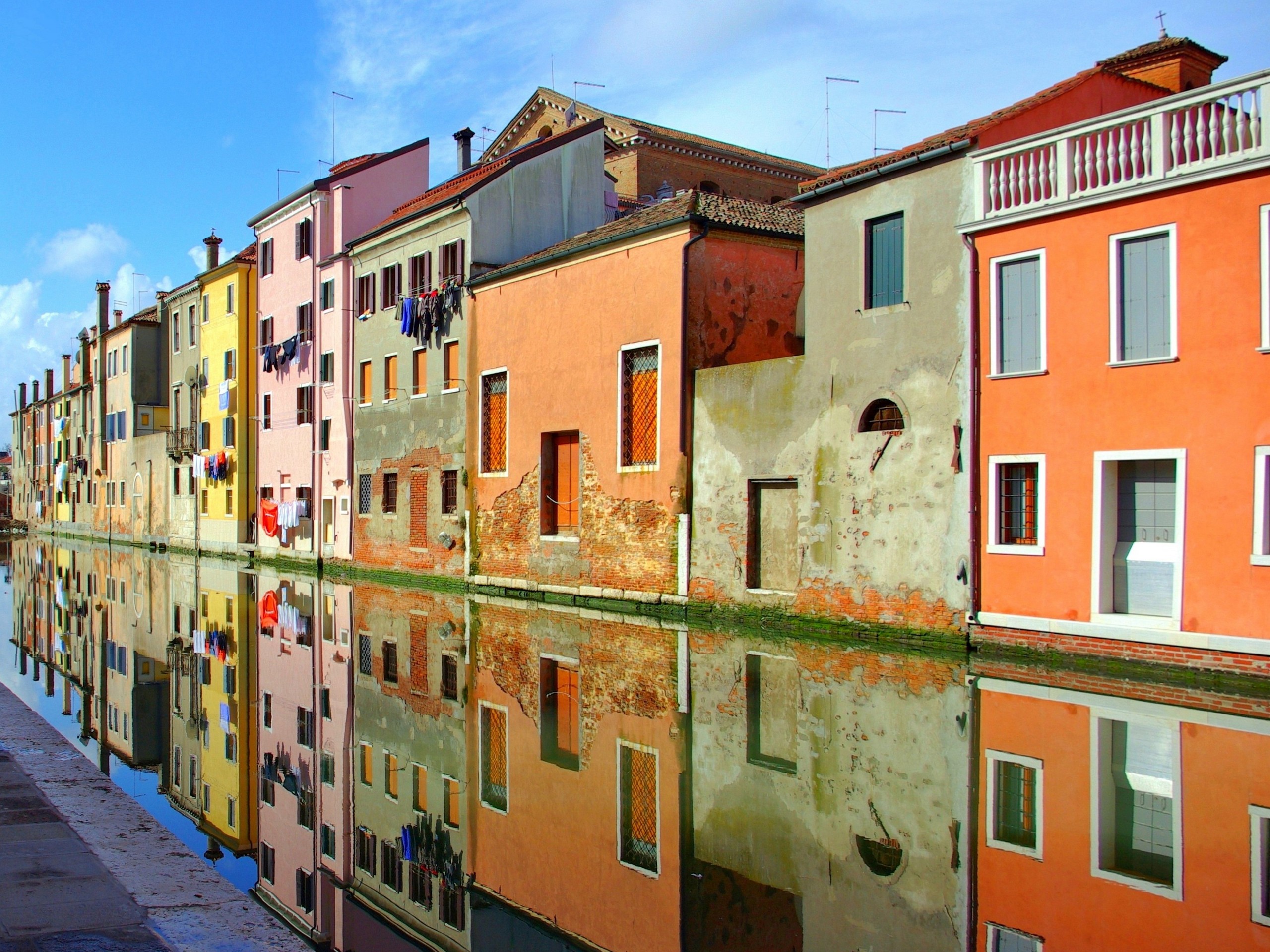 Colorful houses lined up along the Chioggia Channel in Venice