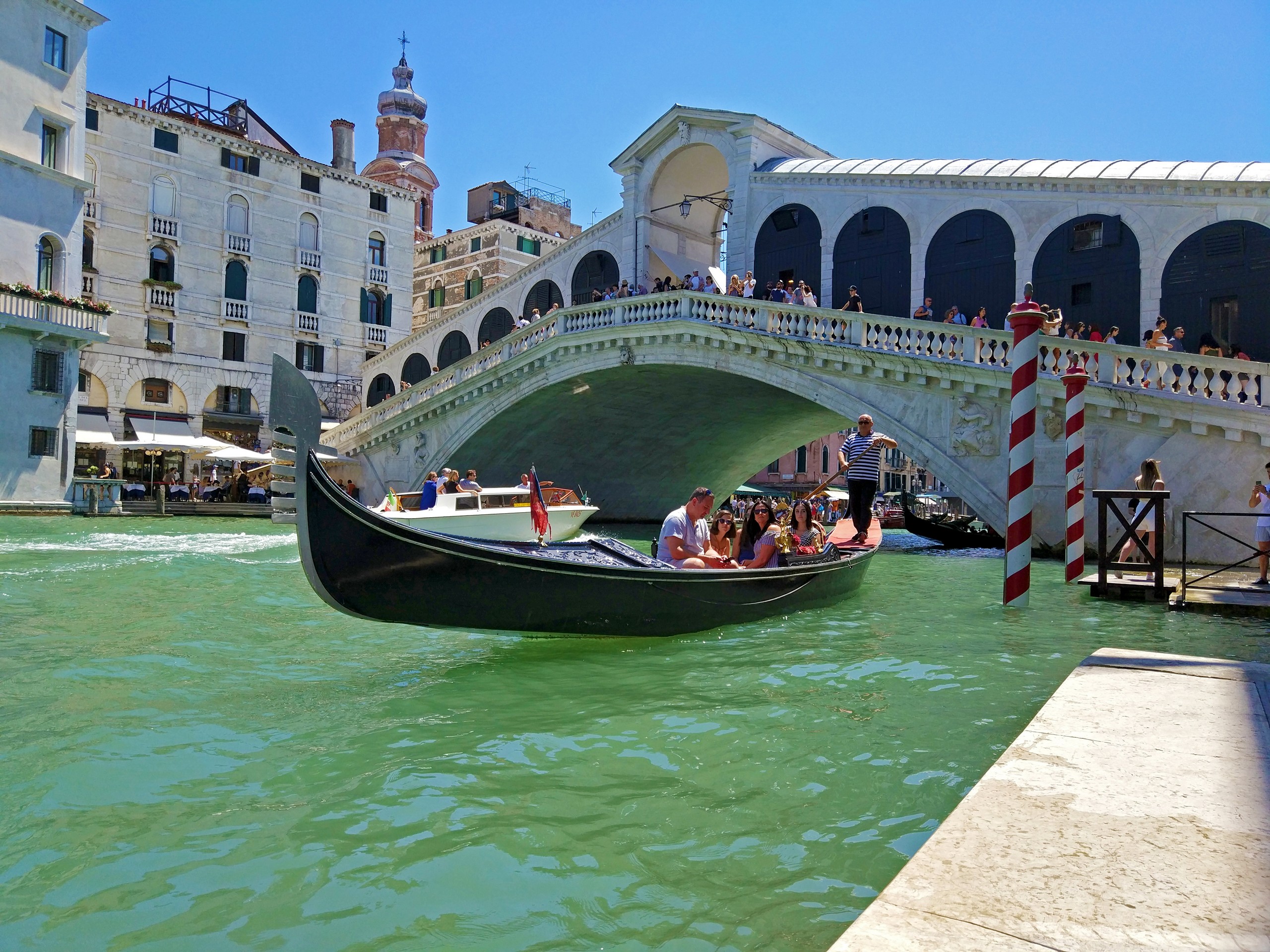 Group of tourists on one of the boats in Venice channel