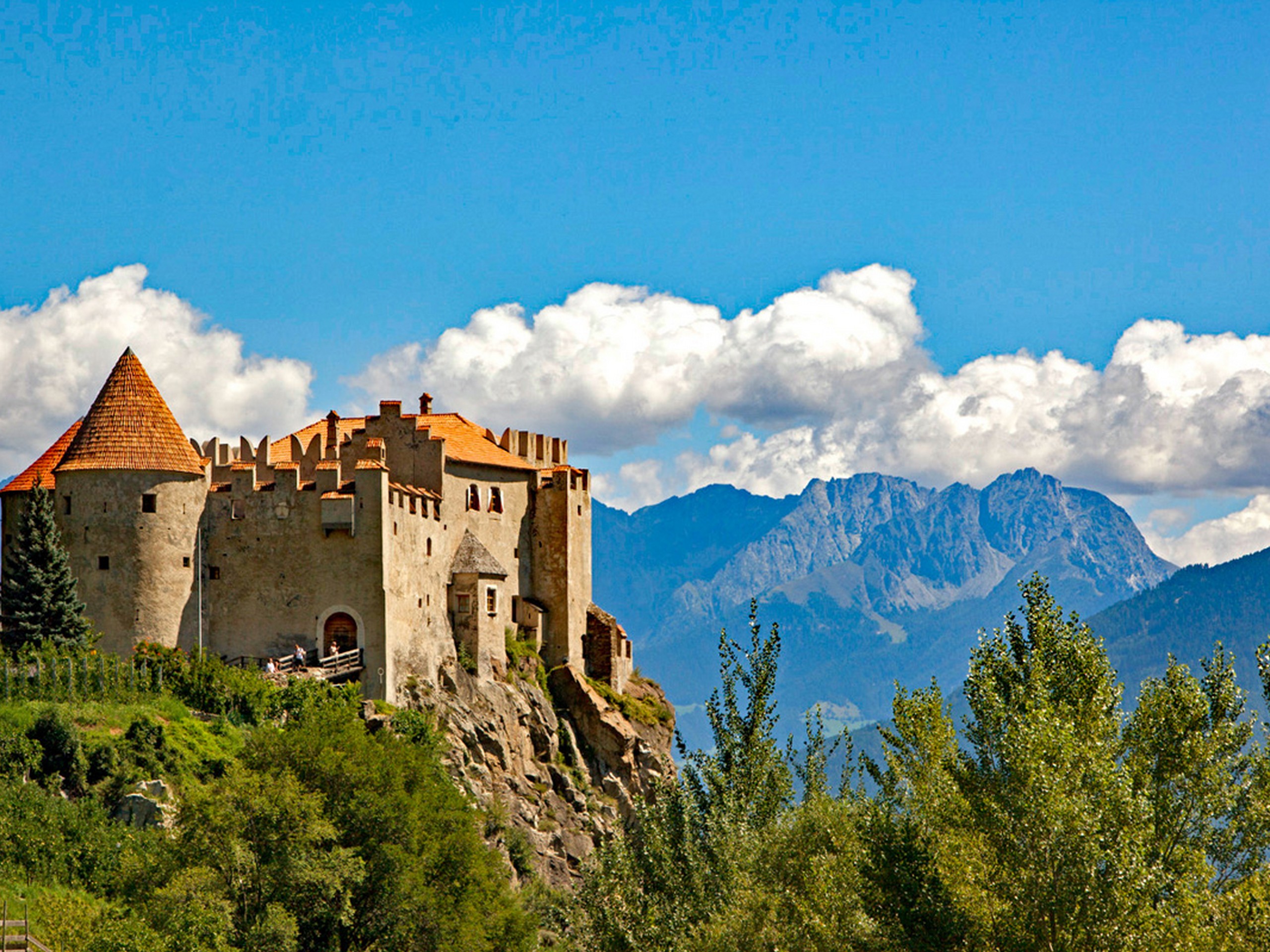 Castle with South Tyrol mountains in the background