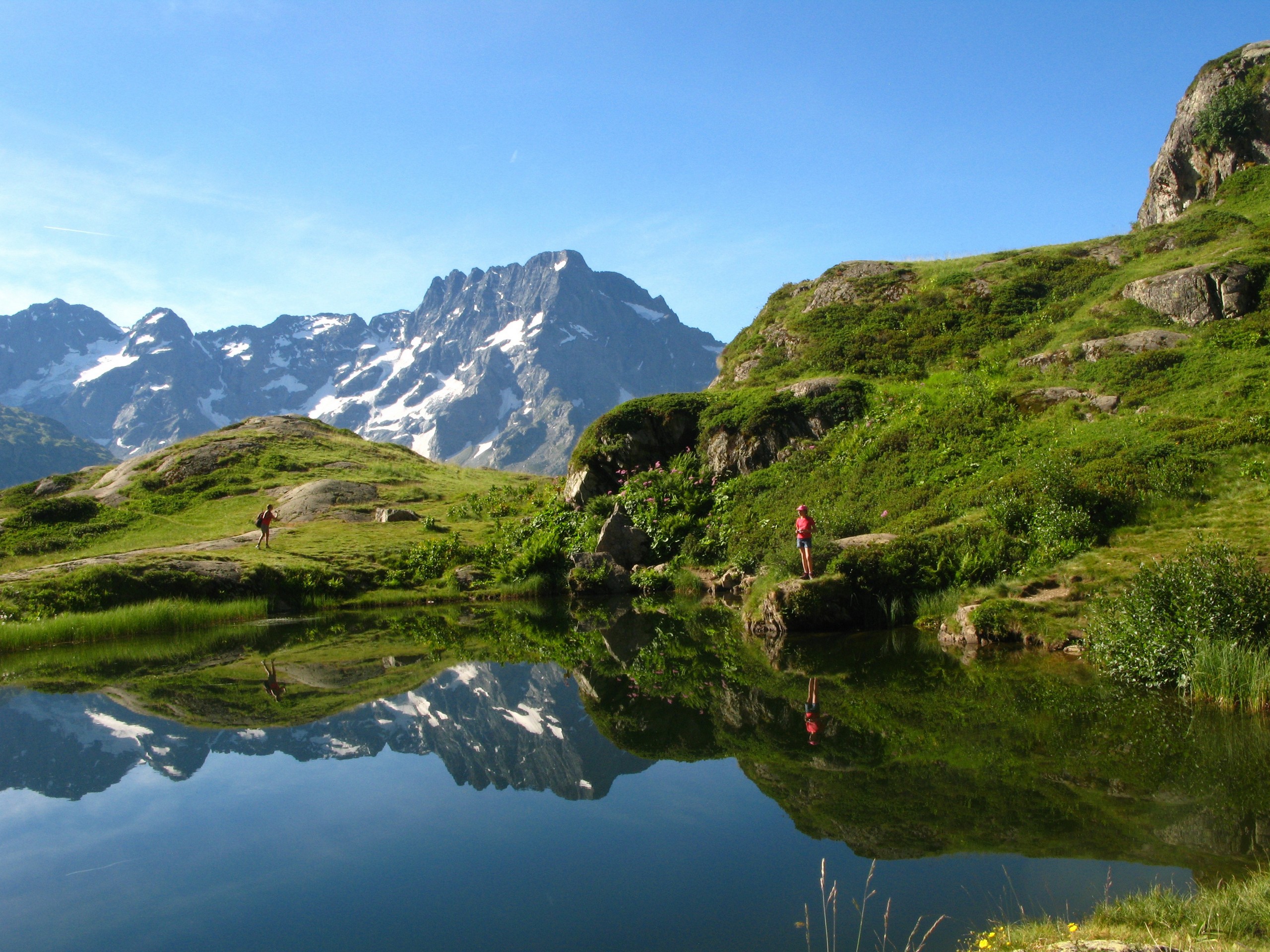 Small lake reflecting the mountain views in French Alps