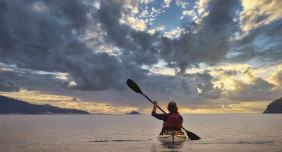 Kayaker in Quebec during the sunset