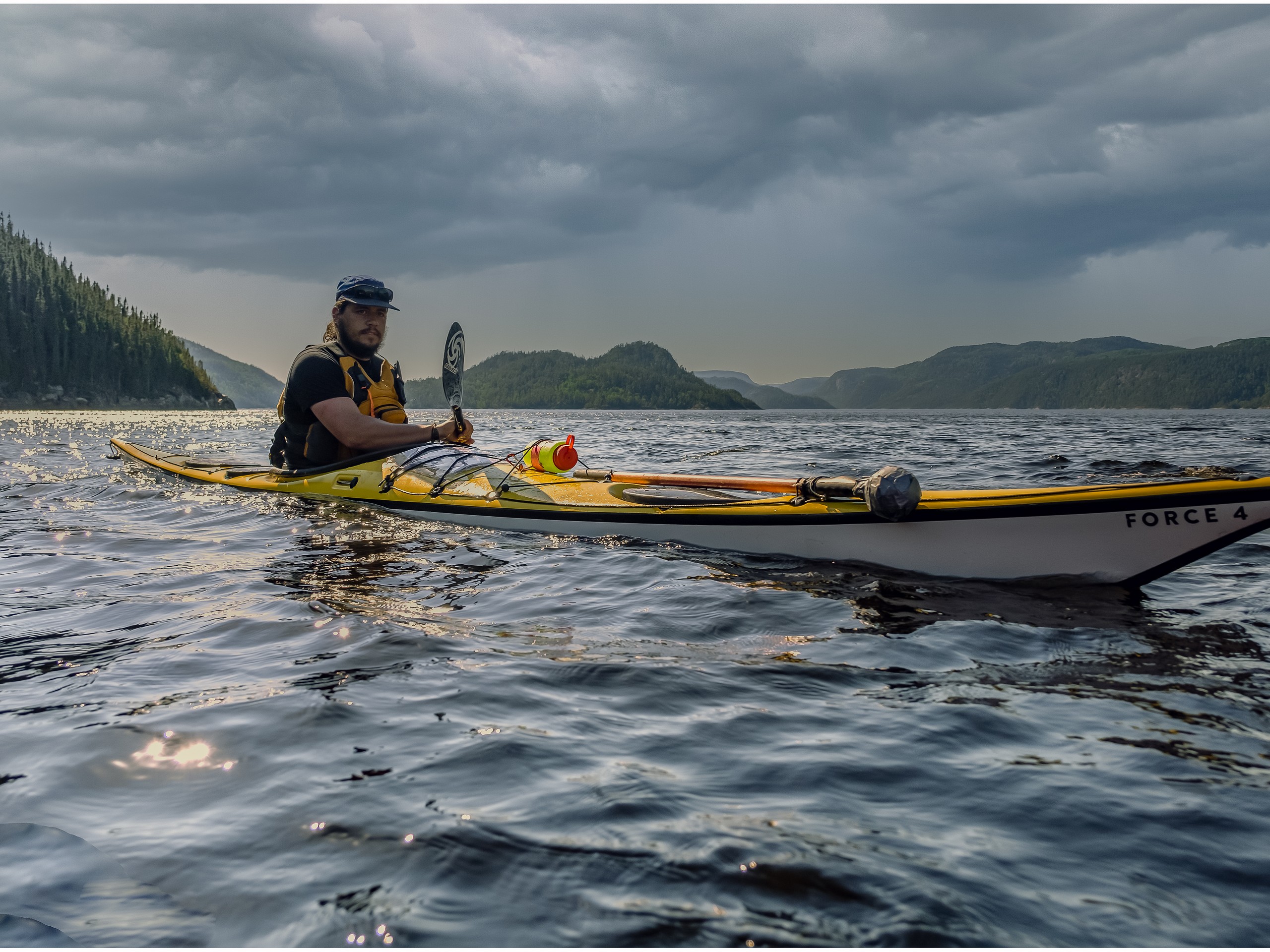 Happy kayaker in sea kayak