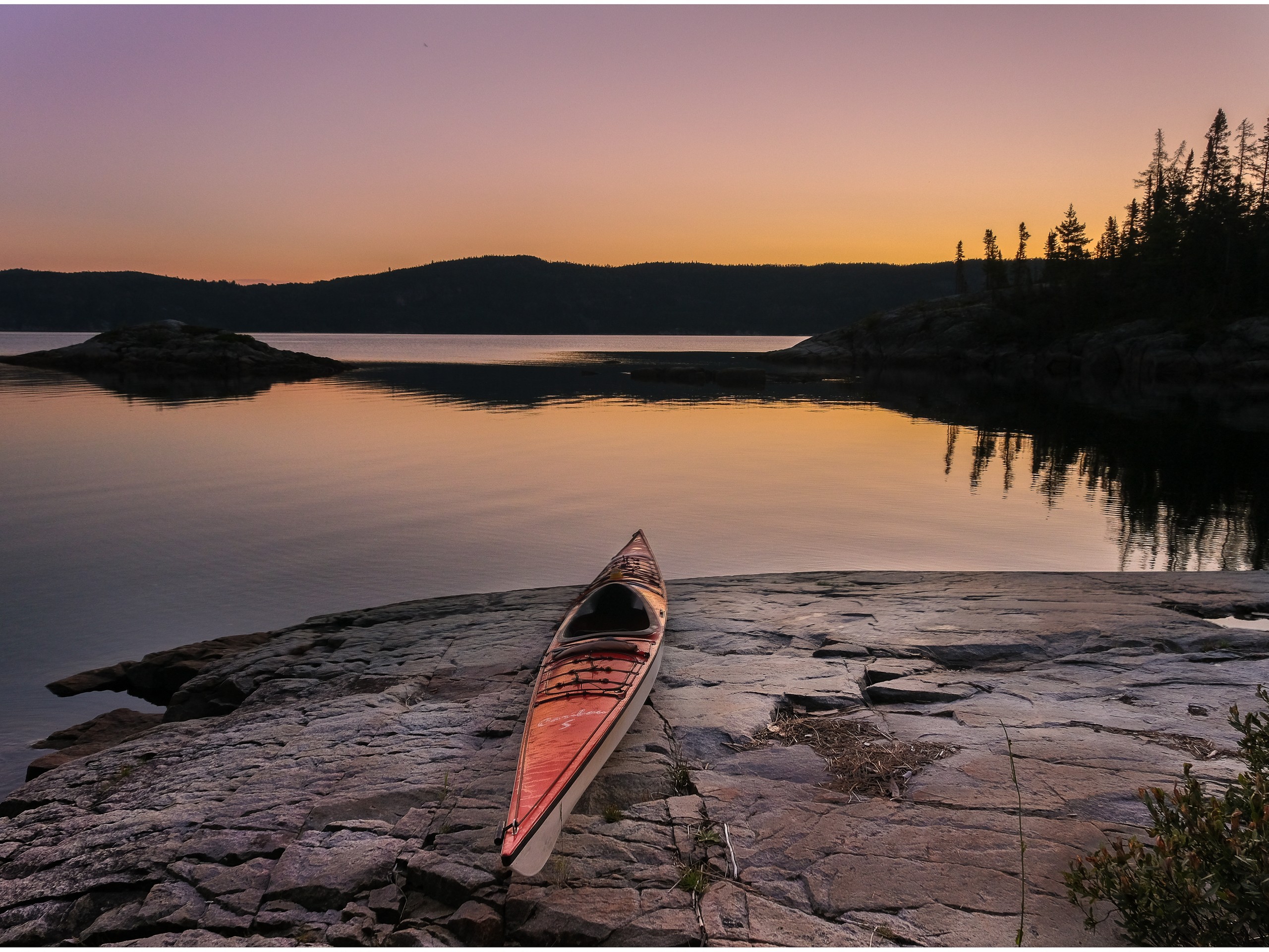 Watching the sunset from kayak in Quebec