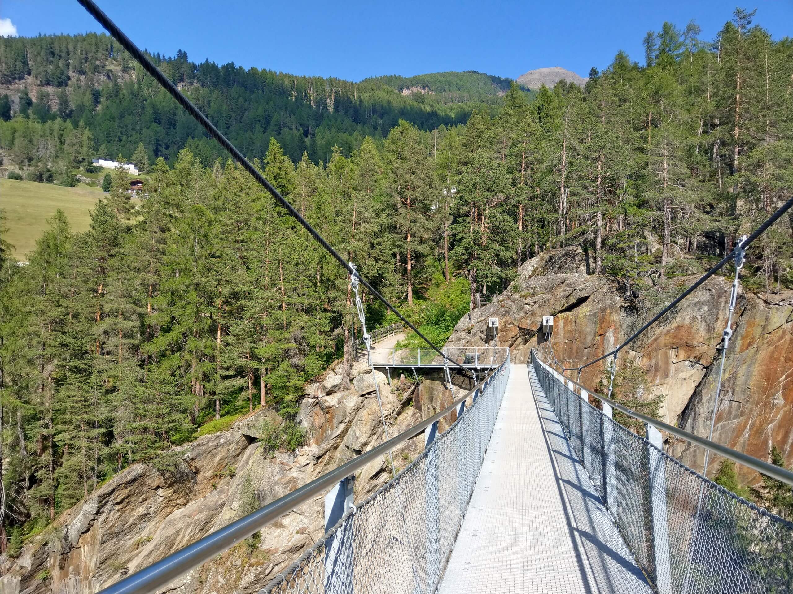Crossing the high bridge in Alps