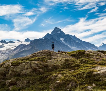 Hiker Looking At Glaciers While On Tour Du Mont Blanc Trek