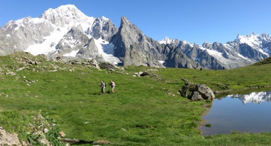 Couple hiking the Tour du Mont Blanc route in the French and Italian Alps