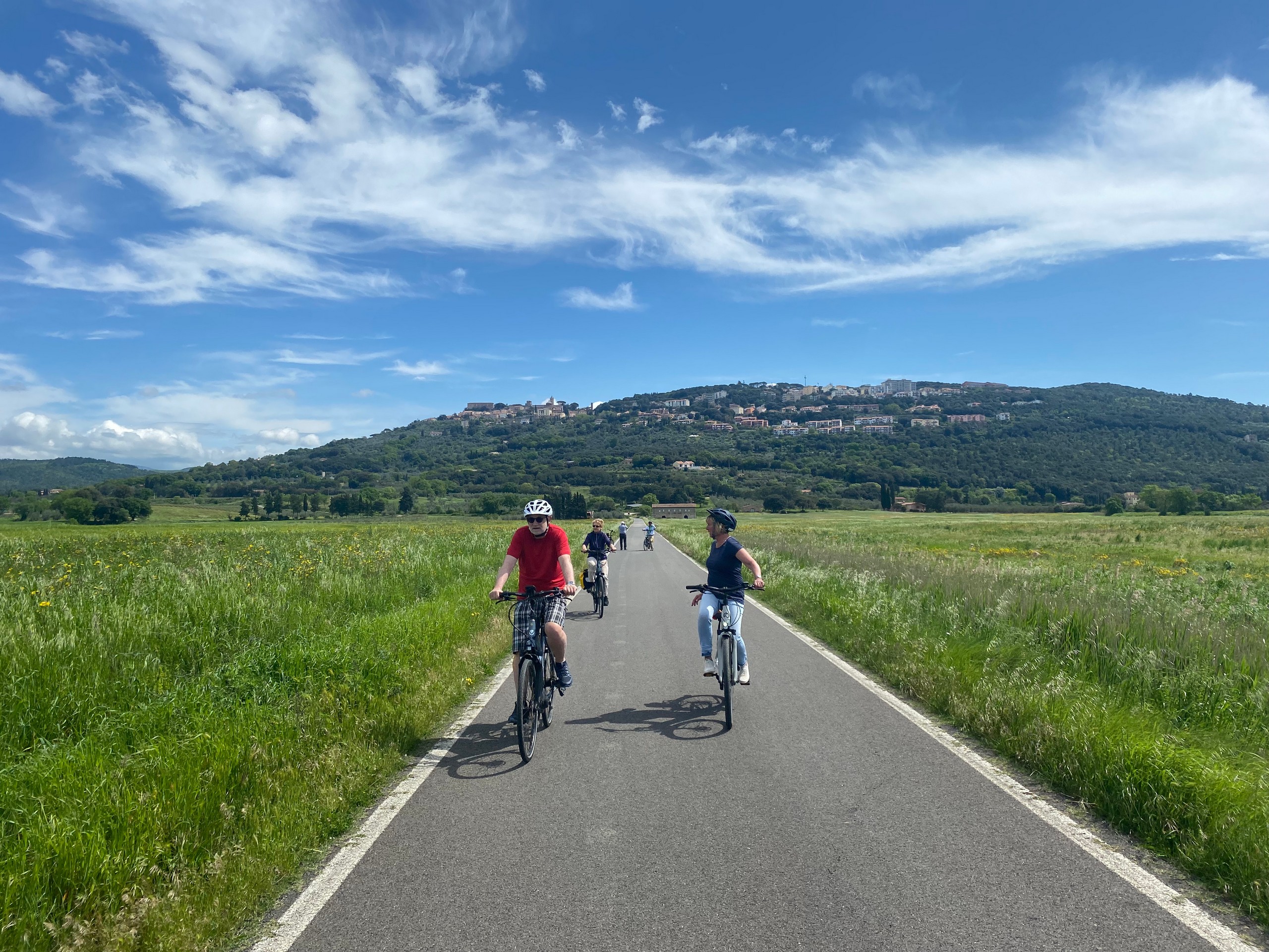 Group of cyclists biking in Tuscany
