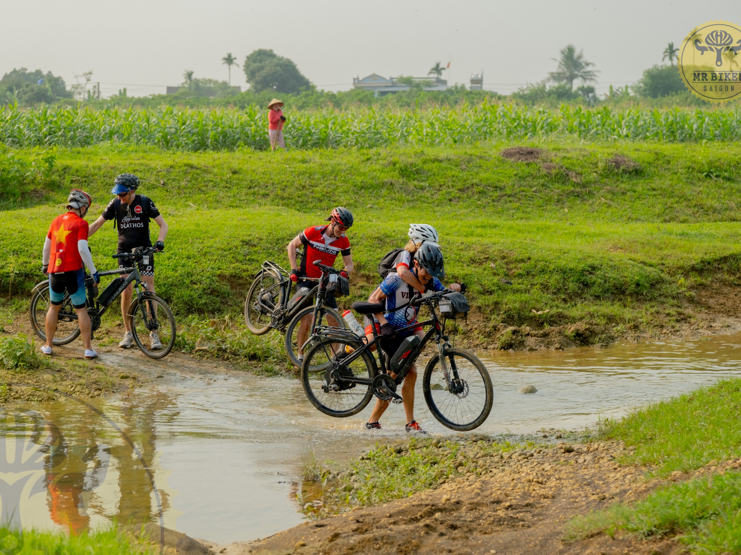 Group of bikers crossing the river in Vietnam