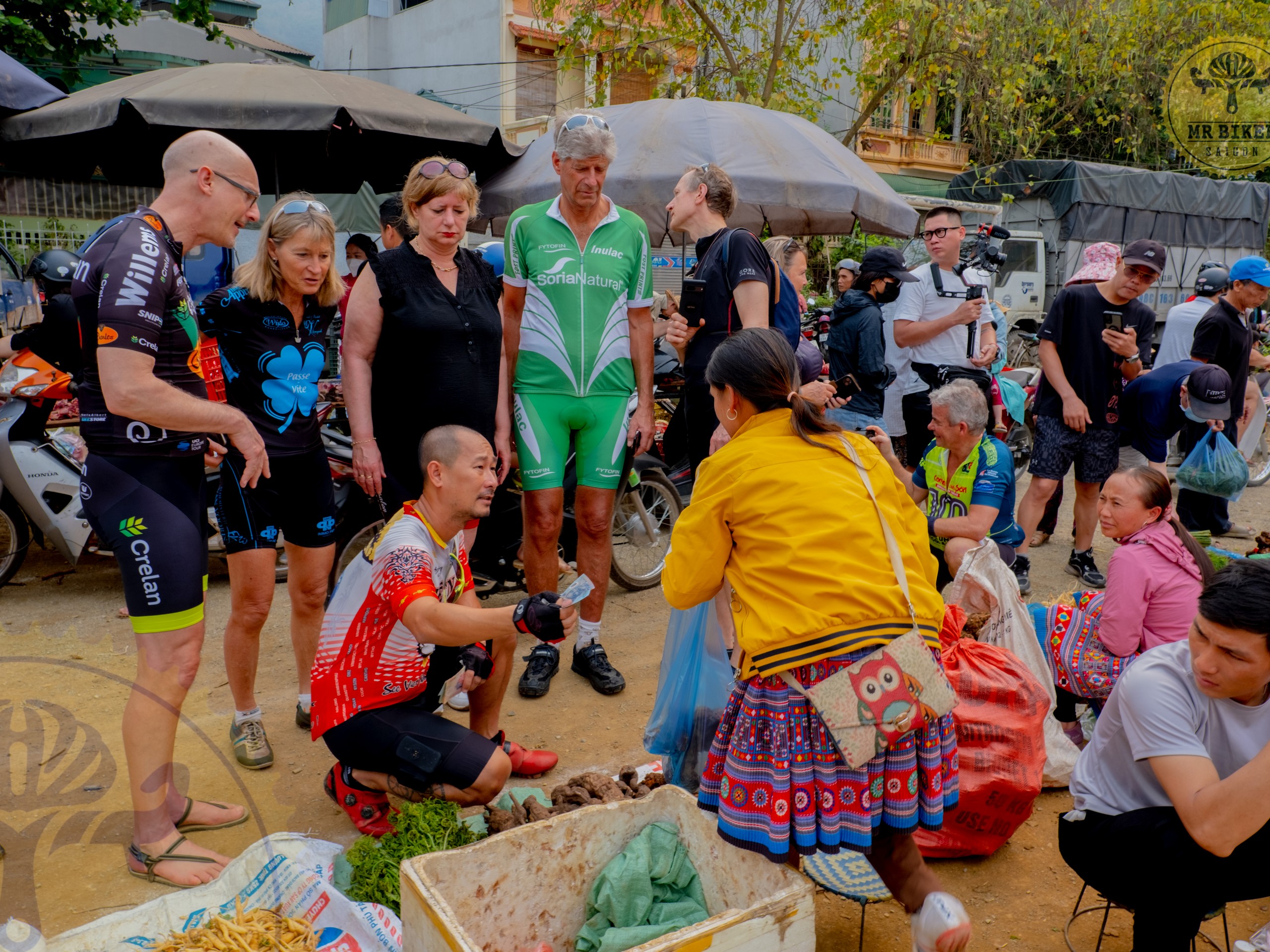 Group of bikers meeting locals, Mai Chau and Pu Luong Tour