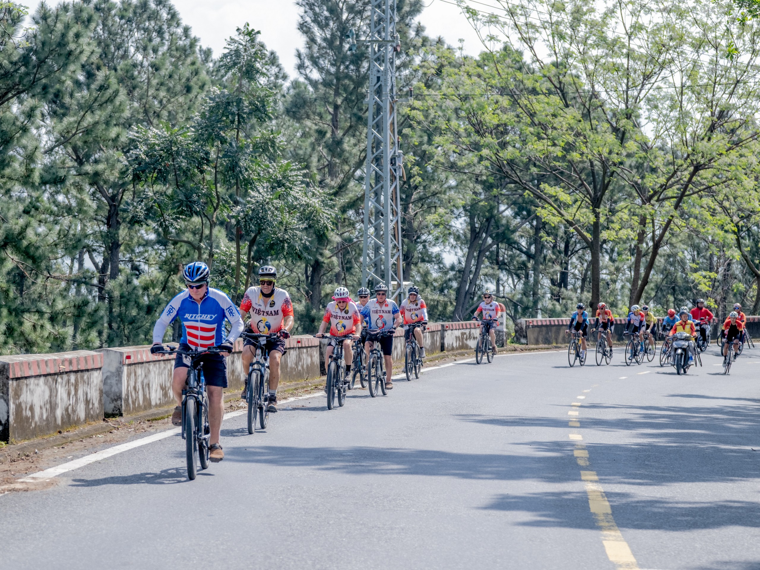 Guided group of bikers riding the road from North of Vietnam to South