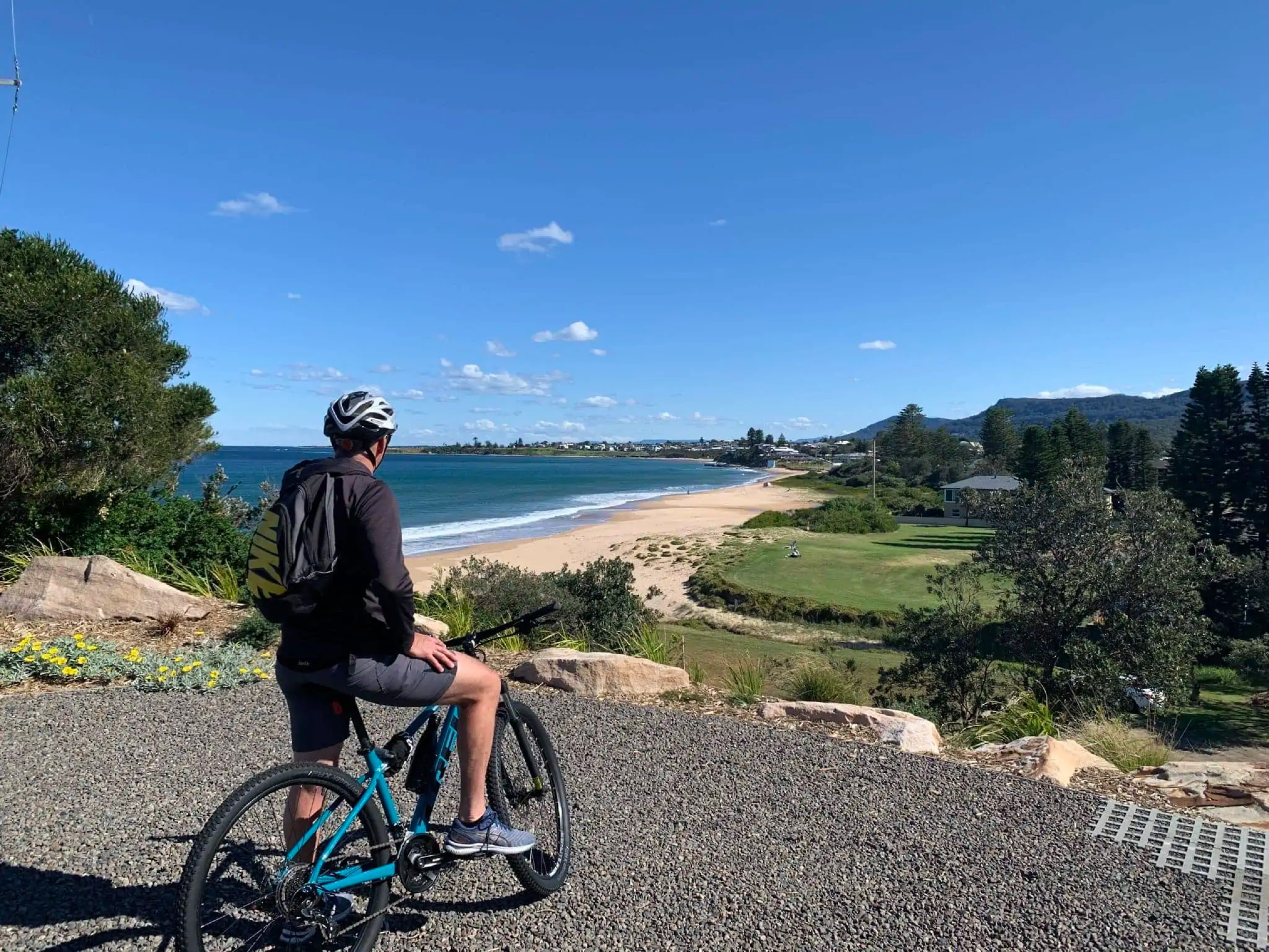 Cyclist on a tour along the Seaside of the Northwest Wales in Australia